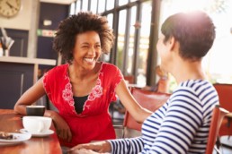 Top 5 ways to make loyalty programs more effective - two women in a cafe